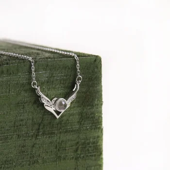 Elegant silver angel wings photo necklace, a symbol of love and protection