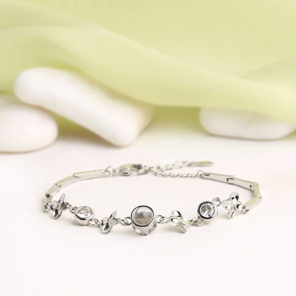 Silver four-leaf clover zircon bracelet with hidden photo, symbolizing luck and love