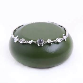 Elegant silver custom clover bracelet with a secret photo compartment