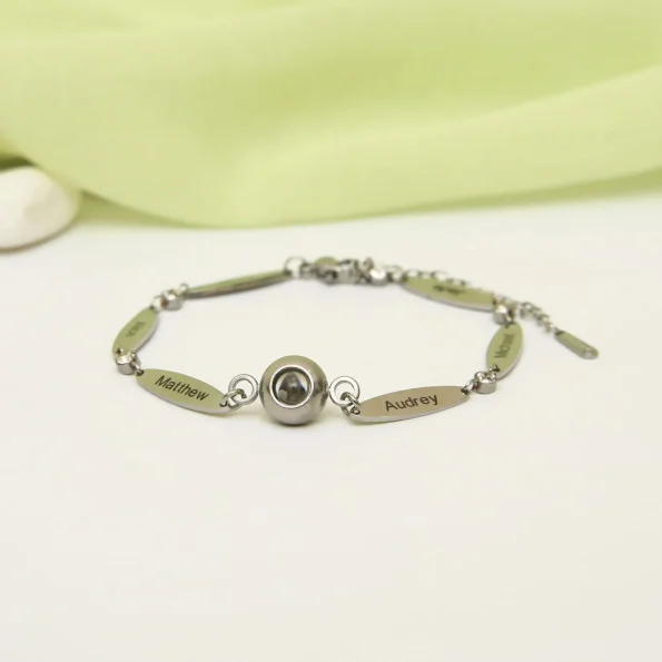 Personalized silver photo bracelet with engraved name, a unique keepsake