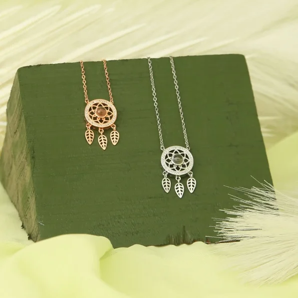 Group of dreamcatcher necklaces in silver and rose gold finishes
