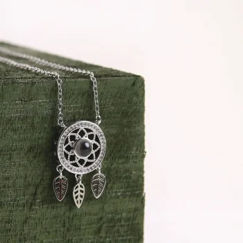 Silver dreamcatcher necklace with a secret photo, perfect for memories