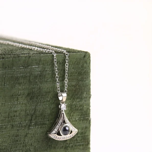 Elegant silver fan-shaped necklace, a unique personalized keepsake with hidden photo