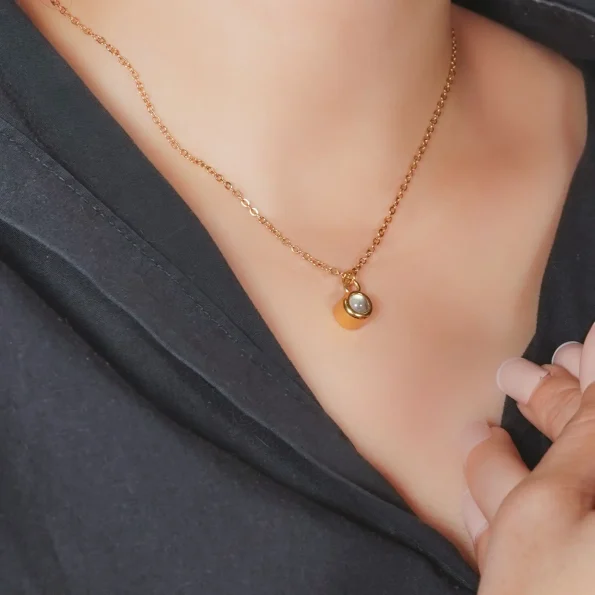 Girl wearing gold circle photo necklace – custom keepsake jewelry for daily wear