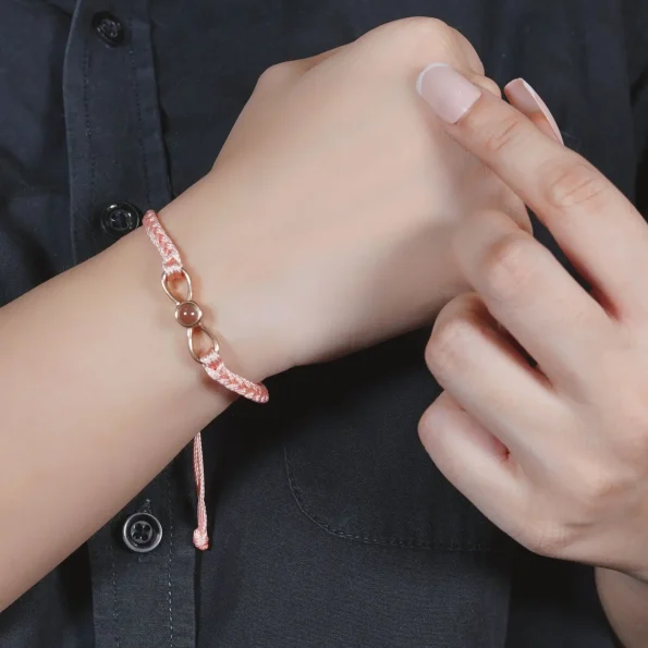 Girl wearing pink infinity photo bracelet – personalized jewelry for everyday