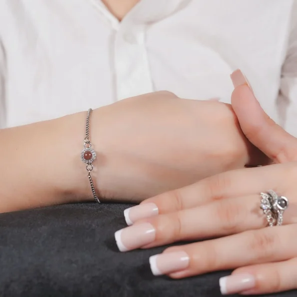 Girl wearing silver petite halo photo bracelet – personalized keepsake jewelry with white zircon stones
