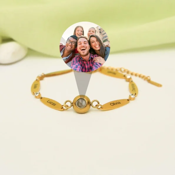 Gold photo bracelet with custom name engraving, perfect for holding memories