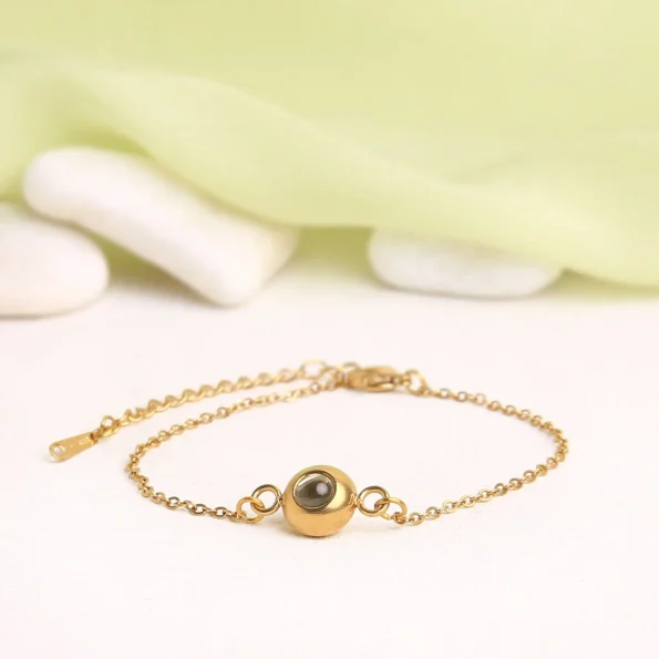 Stylish gold slim chain bracelet with hidden photo, perfect for personalized memories