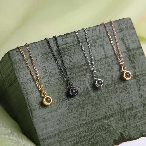 Group of silver, gold, rose gold, and black circle photo necklaces – personalized jewelry collection