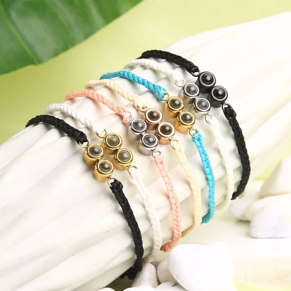 Group of double pendant rope bracelets in beige, turquoise, pink, black, and white – personalized memory jewelry collection