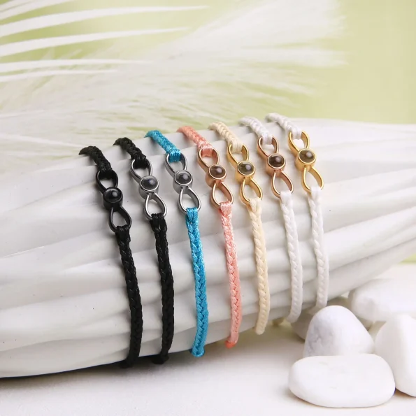 Infinity photo projection bracelets – custom keepsakes in turquoise, black, white, beige, and pink