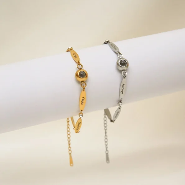 Group of photo bracelets in silver and gold with personalized name engravings