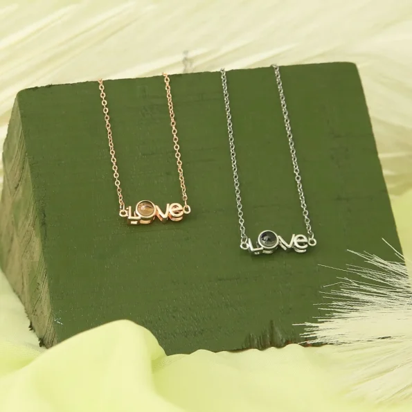 Group of love letter necklaces in silver and rose gold