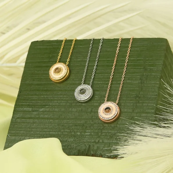 Group of halo necklaces in gold, silver, and rose gold finishes for versatile style