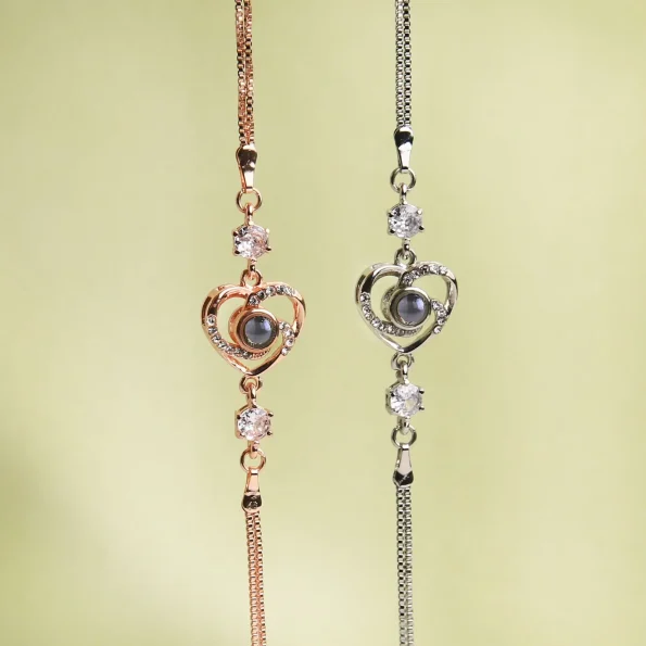 Heart charm bracelets in silver and rose gold, beautifully displayed in group lifestyle setting
