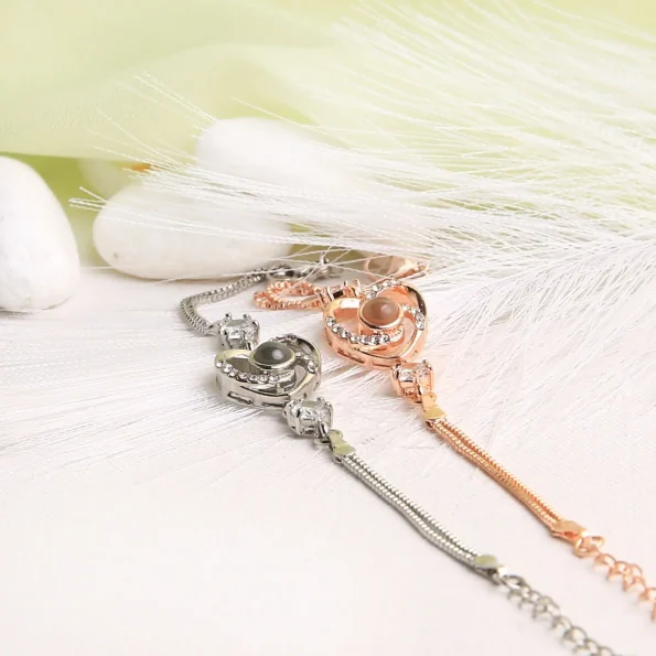 Group collection of heart charm bracelets in silver and rose gold