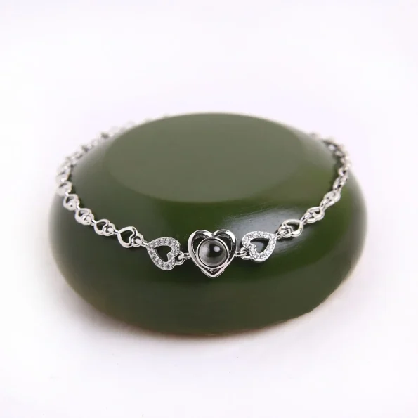 Silver heart zircon bracelet with hidden photo, adding a touch of elegance