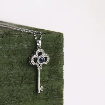 Silver key necklace with hidden photo locket pendant, a timeless keepsake