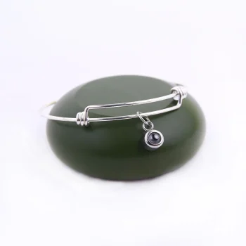 Timeless silver knot bangle bracelet with an elegant twist