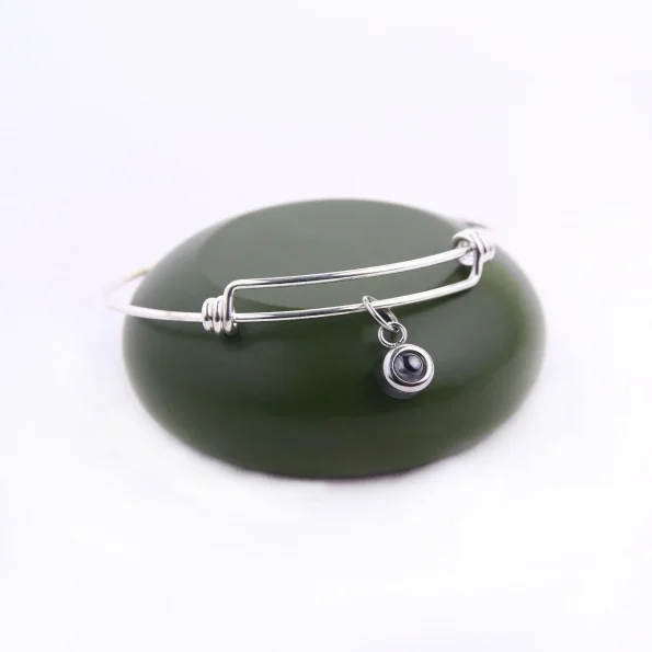 Timeless silver knot bangle bracelet with an elegant twist