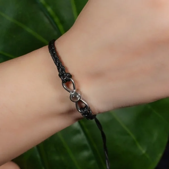 Model wearing black infinity photo bracelet – personalized accessory for pet loss gift