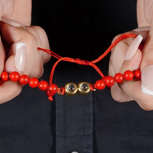 Model wearing red frosted stone projection bracelet – stylish personalized accessory