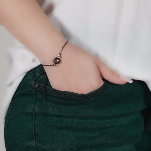 Model wearing black slim chain bracelet, a stylish memory wristband for daily wear