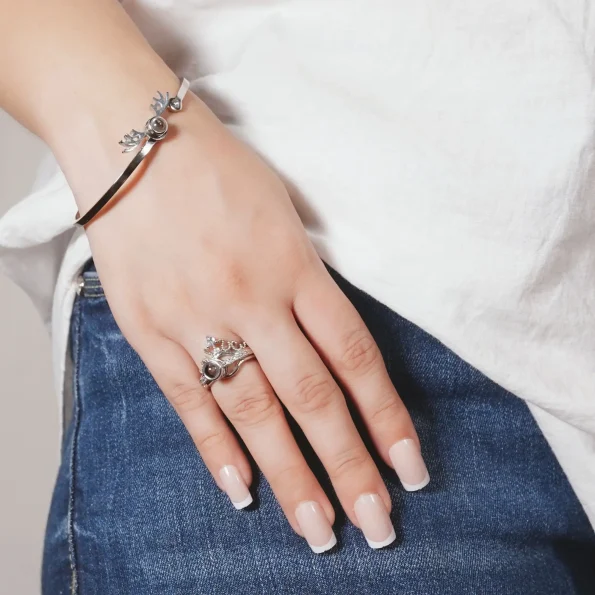 Model showcasing silver bracelet for a chic style