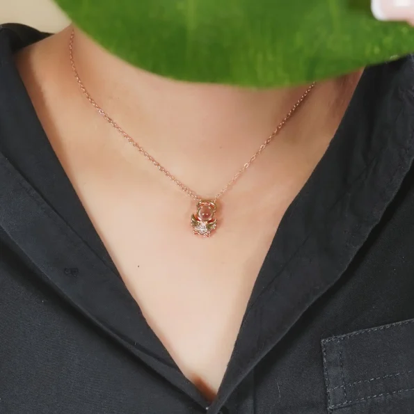 Model wearing rose gold angel necklace, a stylish piece for personal memories