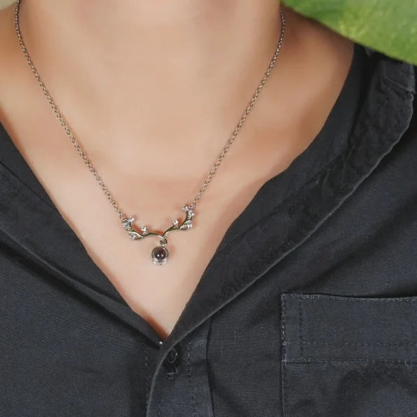 Model wearing silver antler necklace, a timeless photo keepsake