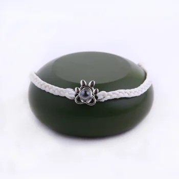 hite pet paw photo bracelet from the collection, offering a clean and classic look
