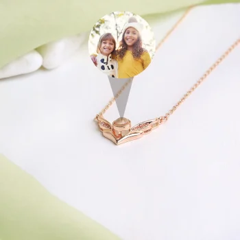 Rose gold angel wings pendant, perfect for holding a cherished memory