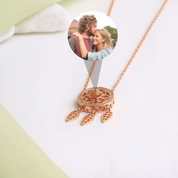Rose gold dreamcatcher pendant, adding a sentimental touch to style