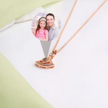 Rose gold fan-shaped pendant with custom photo, adding a sentimental touch