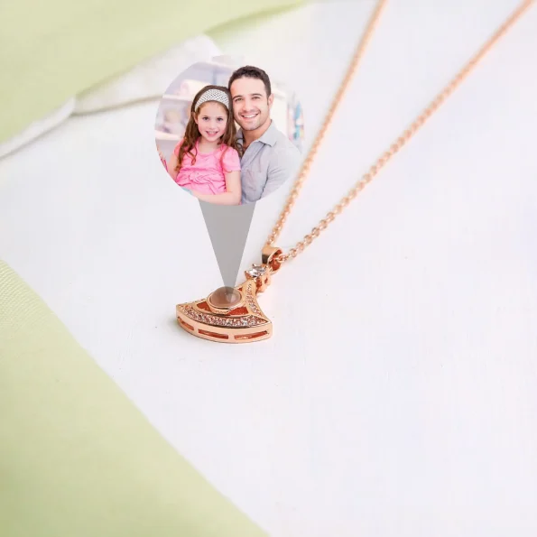 Rose gold fan-shaped pendant with custom photo, adding a sentimental touch
