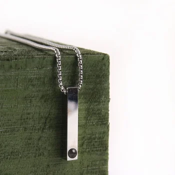 Sleek silver bar necklace with hidden photo locket, a meaningful accessory for men