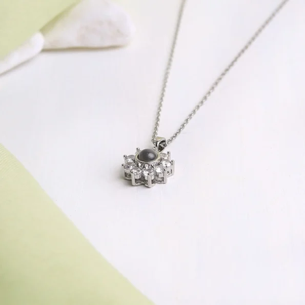Silver flower charm necklace, a timeless keepsake for special moments