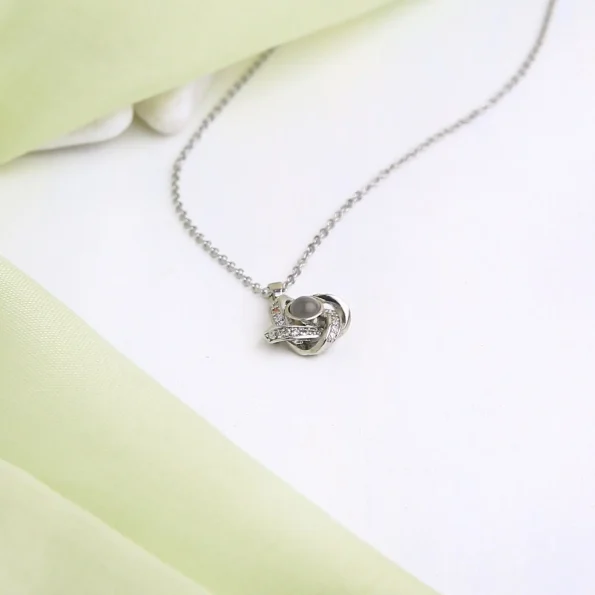 Classic silver four-leaf necklace with a hidden locket for precious photos