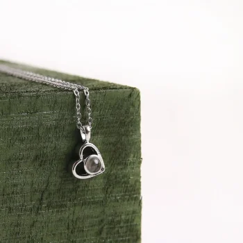 Elegant silver heart pendant, perfect for holding precious memories