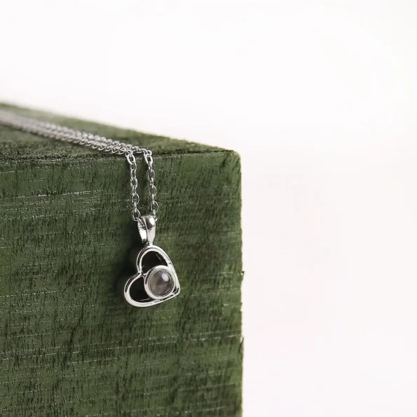 Elegant silver heart pendant, perfect for holding precious memories