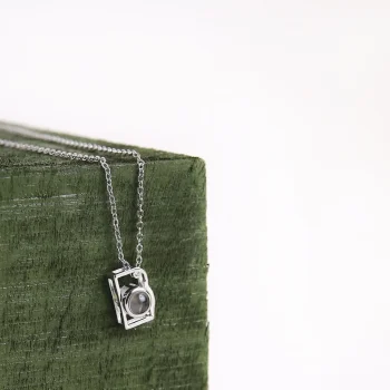 Elegant silver camera necklace, a keepsake for holding favorite memories