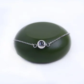 Silver chain bracelet with photo locket, a timeless keepsake for capturing memories