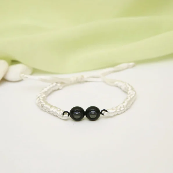 Elegant white double pendant braided bracelet, a versatile accessory