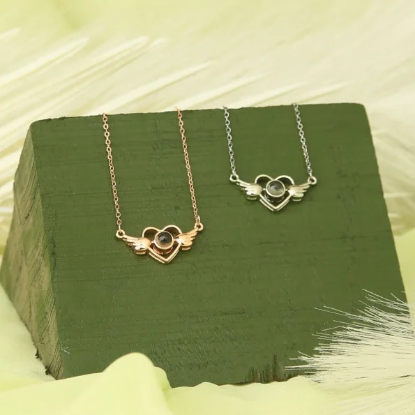 Group of wings heart necklaces in silver and rose gold for a versatile collection
