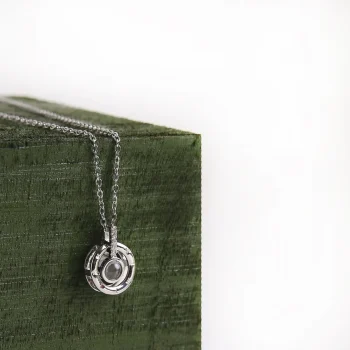 Elegant silver roman projection necklace with a pendant angled slightly to showcase its sleek and minimalist design, perfect for gifting someone special.