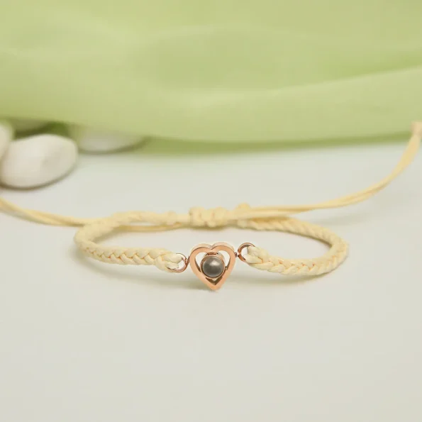 Beige rope heart bracelet with a secret photo inside, a timeless symbol of love.