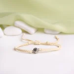 cream rope projection bracelet close-up sentimental jewelry