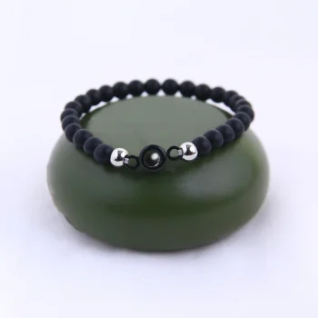 Close-up of black frosted photo bracelet, highlighting its sleek design and hidden memory feature.