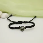 black rope heart bracelet closeup intricate design