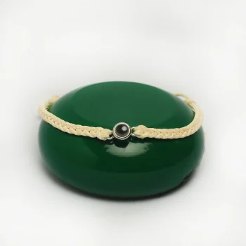 Close-up of a cream rope projection bracelet, a sentimental jewelry piece with hidden meaning.